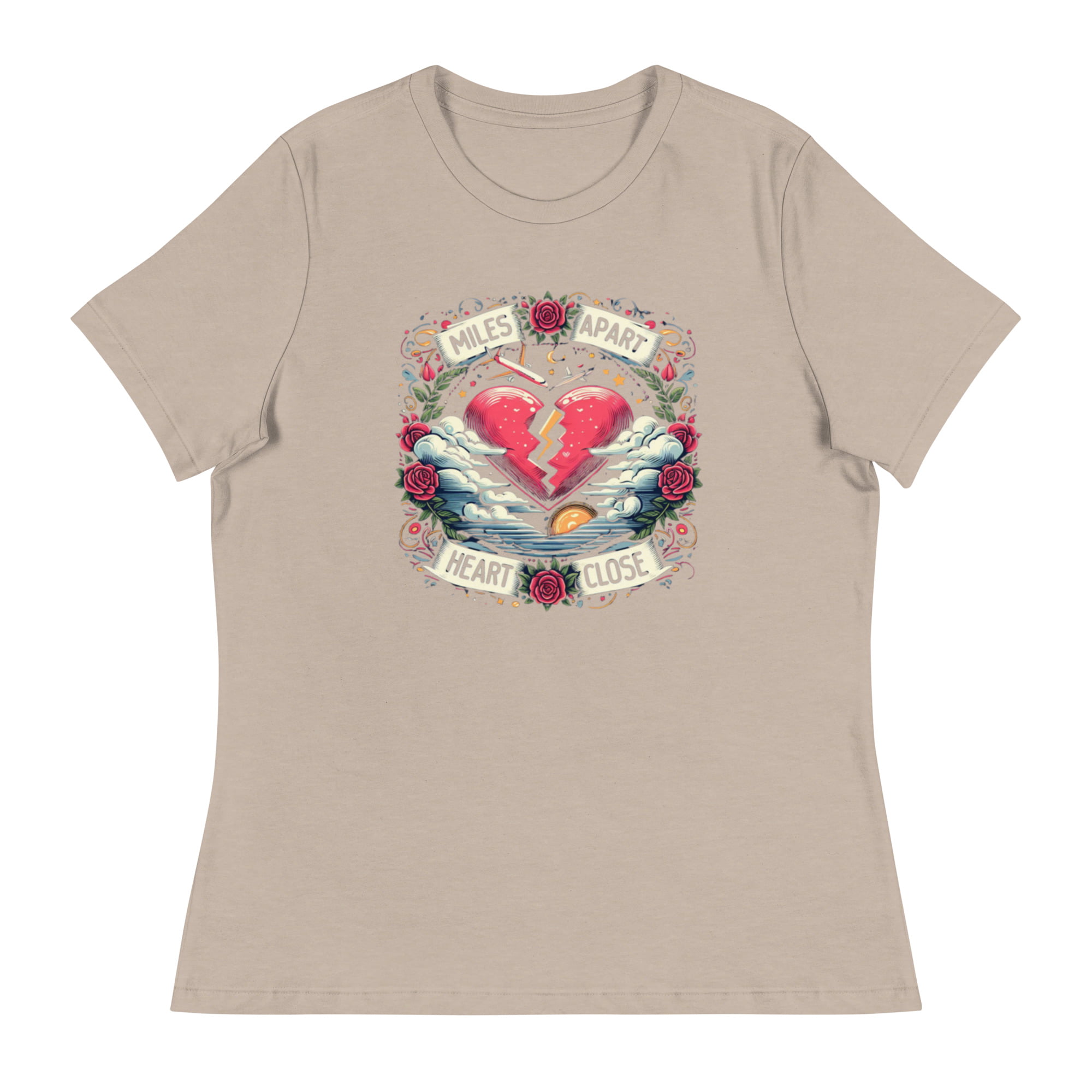 A t-shirt featuring a vibrant design of a split heart surrounded by roses and clouds with the text “Miles Apart, Heart Close”, symbolizing the unbreakable bond in long-distance relationships.