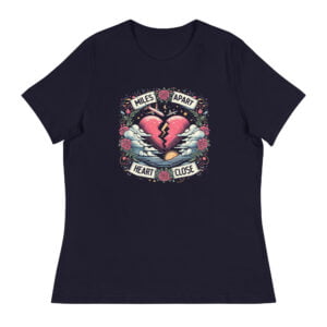 A navy blue t-shirt featuring a vibrant design of a split heart surrounded by roses and clouds with the text “Miles Apart, Heart Close”, symbolizing the unbreakable bond in long-distance relationships.