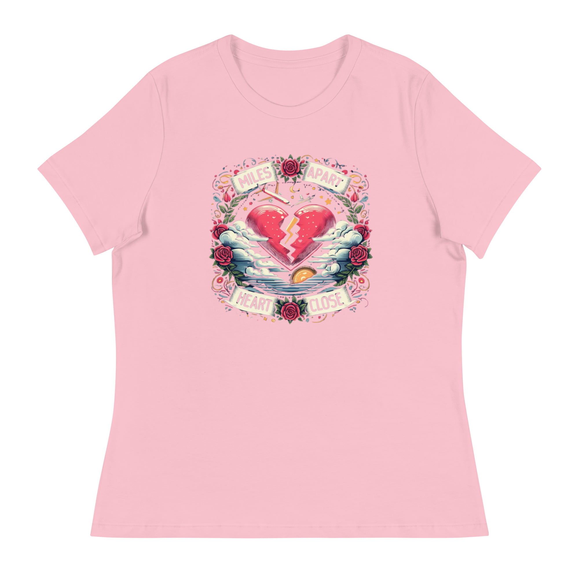 A t-shirt featuring a vibrant design of a split heart surrounded by roses and clouds with the text “Miles Apart, Heart Close”, symbolizing the unbreakable bond in long-distance relationships.